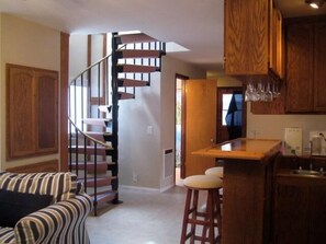 Downstairs living room, , staircase to upstairs bunkroom and deck