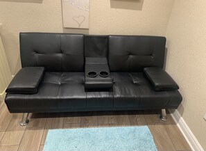 Relax in the leather futon to watch TV