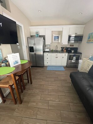 Enter into the open living room and kitchen area