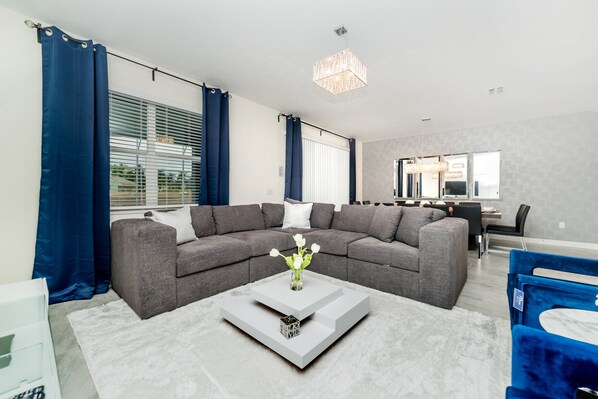 Open floor plan with sliding glass doors that lead to private pool area.