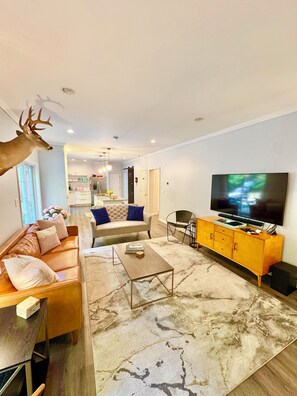 Ground floor living room with 75 inch TV