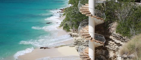 Iconic Cupecoy Beach spiral staircase is steps from your front door.  