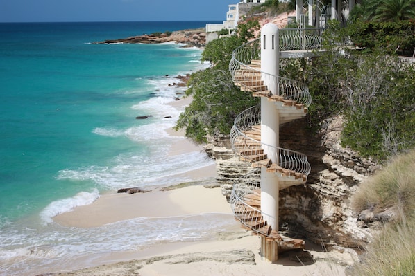 Iconic Cupecoy Beach spiral staircase is steps from your front door.  