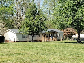 Enjoy corn hole or badminton on the spacious, green front lawn.