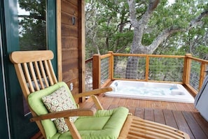 Soak in the private hot tub under the stars.