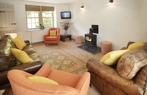 Ground floor:  Relax in the sitting room with wood burning stove.