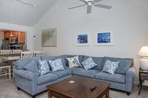 The great room has vaulted ceilings adding to the open, roomy feel.
