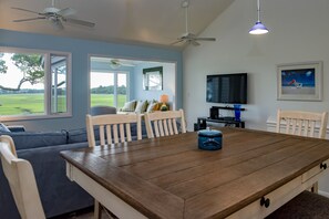 The living area is on the upper level of this villa for maximum marsh views.
