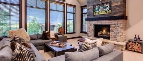 Great room with HDTV, fireplace, and amazing views out to Round Valley and the Uintas