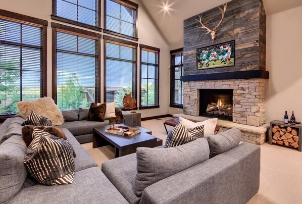 Great room with HDTV, fireplace, and amazing views out to Round Valley and the Uintas