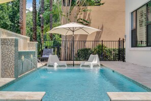 Enjoy the Florida sunshine at your own private pool with spillover spa