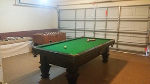 Games room with pool and foosball