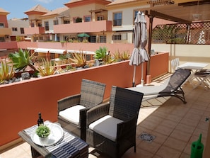 Large terrace with sitting area, sun loungers, dining area