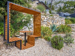 Plant, Plant Community, Furniture, Botany, Tree, Outdoor Furniture, Shade, Architecture, Table, Wood