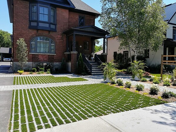 Front of house, private porch and the dedicated parking spots