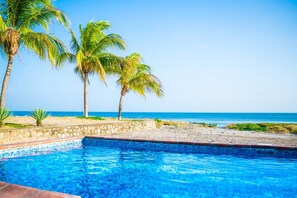 Relax in the pool by the beach