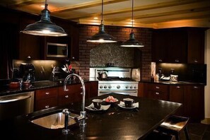 Gourmet Kitchen with Stone-Faced Gas Range