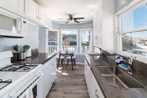 Main house kitchen facing towards breakfast nook