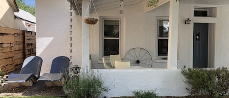 Front porch with plenty of space to sit and hang out watching Downtown.