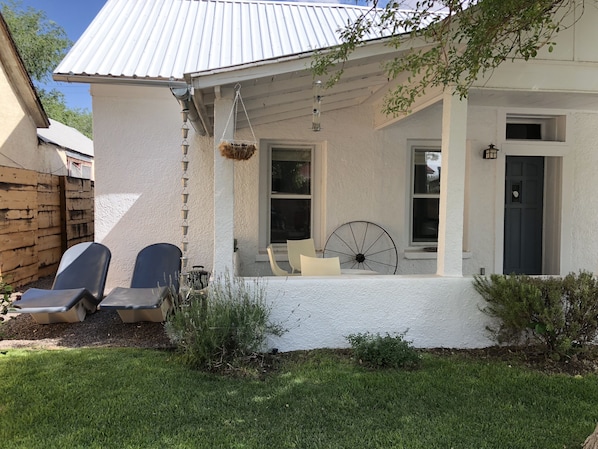 Front porch with plenty of space to sit and hang out watching Downtown.