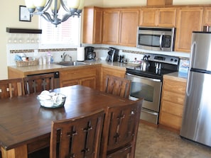 Kitchen with all major and minor appliances, table sets up to 8 people