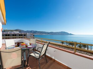 Sky, Water, Furniture, Table, Building, Wood, Chair, Shade, Mountain, Outdoor Furniture