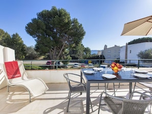 Sky, Furniture, Table, Chair, Outdoor Table, Outdoor Furniture, Shade, Flowerpot, Tree, Building
