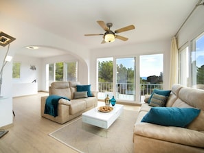 Furniture, Property, Couch, Ceiling Fan, Green, Interior Design, Comfort, Living Room, Floor, Wood