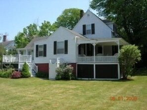 Back yard with back deck and side portch with out door shower.