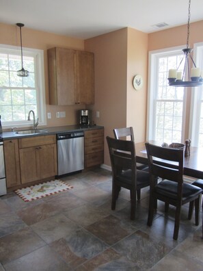 Eat in kitchen with table that can seat up to 8 with extension added+ great view