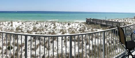 Living room balcony just feet from emerald Gulf waters and powdery sand. 