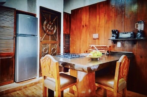 The Studio features a fully equipped kitchenette to prep & savor meals.