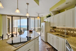 Kitchen has a great cooktop with a view while cooking!
