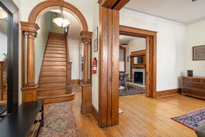 first floor entry way with view of first to second floor staircase