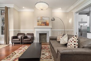 first floor tv room with sofa and coffee table