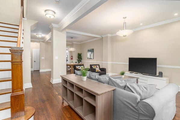 first floor TV area with view of staircase