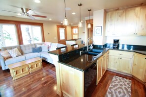 Spacious kitchen with granite counters and soft closing cabinets.