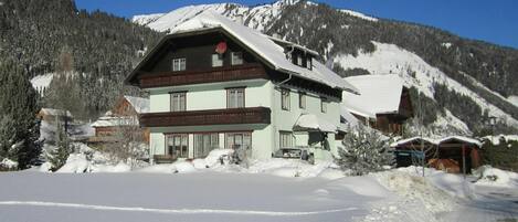 Sky, Snow, Mountain, Property, Window, Building, House, Slope, Tree, Mountainous Landforms