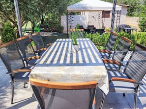 Plant, Furniture, Table, Outdoor Table, Chair, Outdoor Furniture, Wood, Tree, Building, Grass