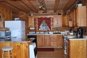 A spacious kitchen is furnished with everything you can need!