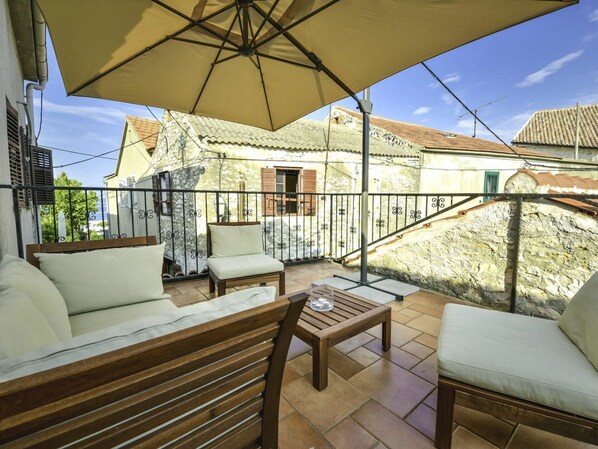 Table, Furniture, Property, Couch, Building, Flowerpot, Wood, Plant, Shade, Umbrella