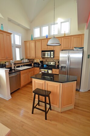 Beautiful and bright- granite and stainless kitchen. New dishwasher and fridge.