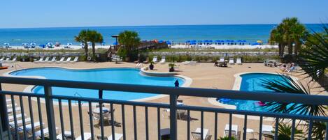 Large wrap around balcony overlooking 2 pools and Beach