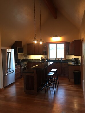 Tidy little kitchen area featuring Jen Air stainless steel appliances 