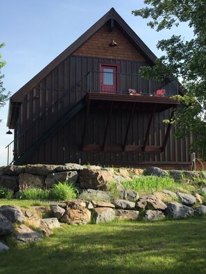 Iron staircase and elevated deck area overlooking the grounds 