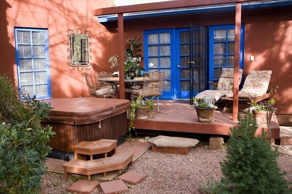 Lower deck with private hot tub.Photo taken from the garden.