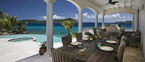 Outdoor dining by pool with a totally private view and access to ocean.