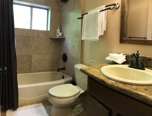 Bathroom with bathtub.