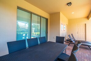 Covered Lanai showing dining and sun loungers