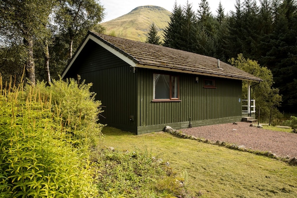 Whooper Lodge with the mountain of Ben More towering above
